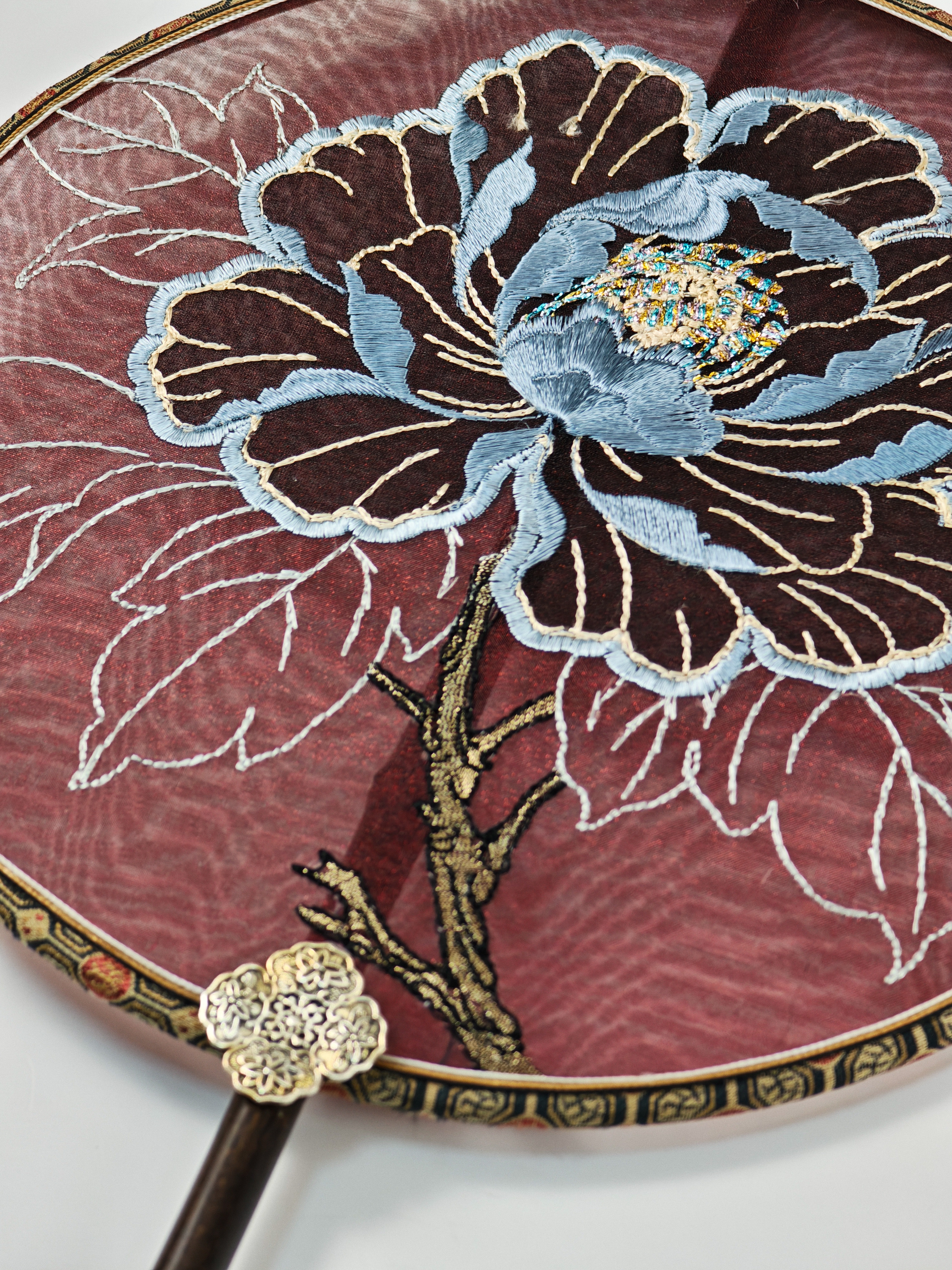 White leaf lines and peony stem embroidery detail